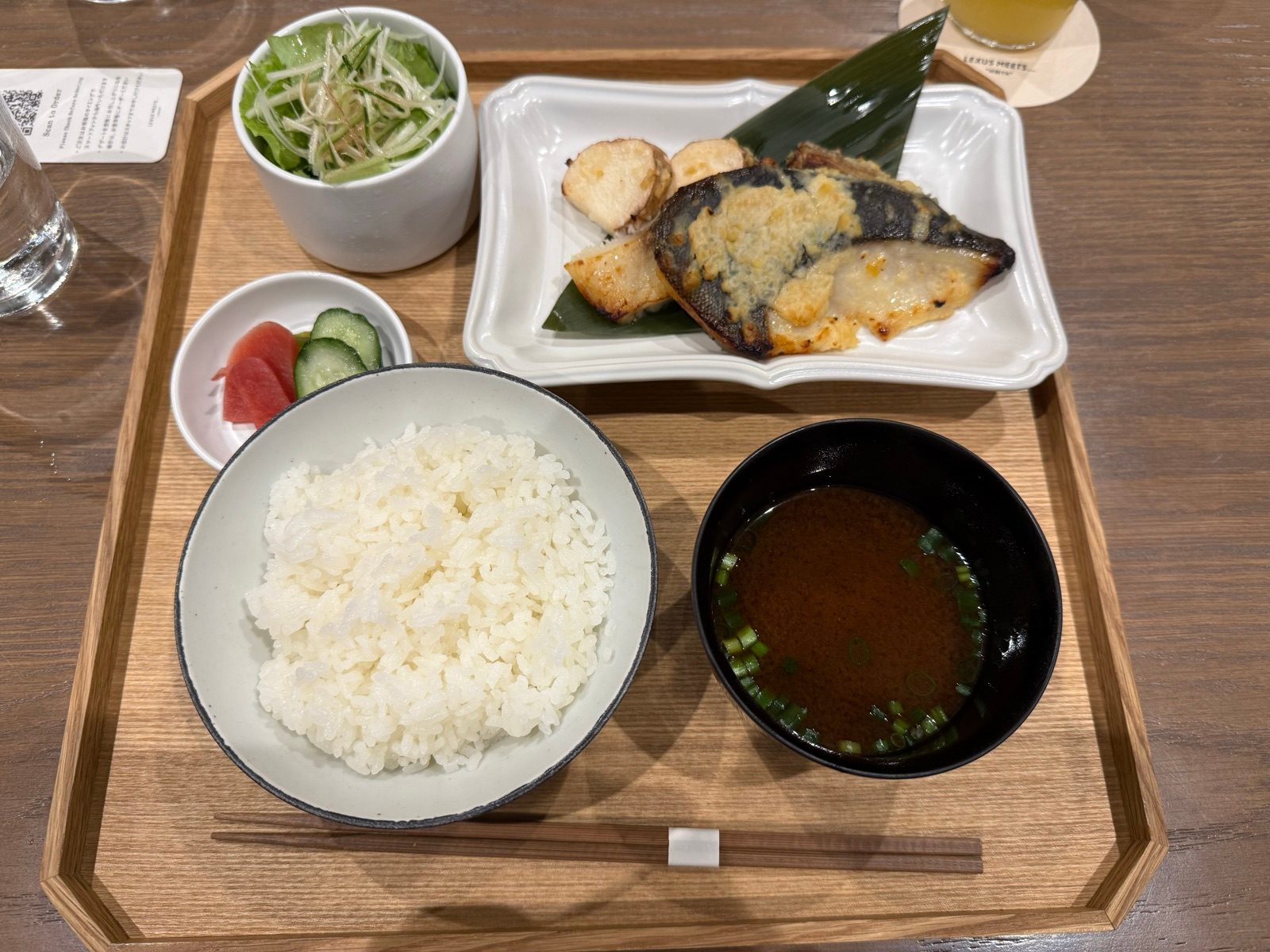 A set meal with rice, soup, grilled fish, and vegetables