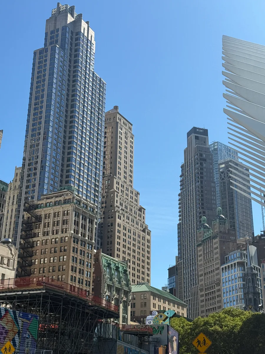 Downtown skyscrapers beside the white ribs of the Oculus