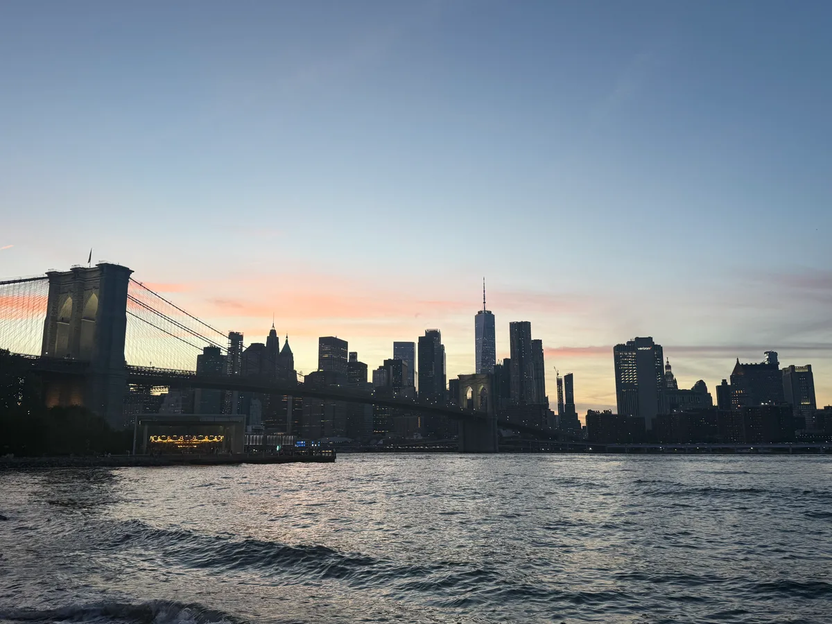 The Brooklyn Bridge and Lower Manhattan skyline at sunset
